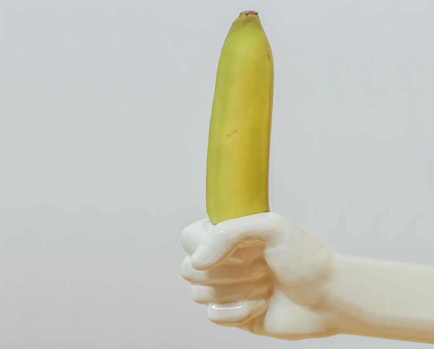 die Banane symbolisiert den vergrößerten Penis